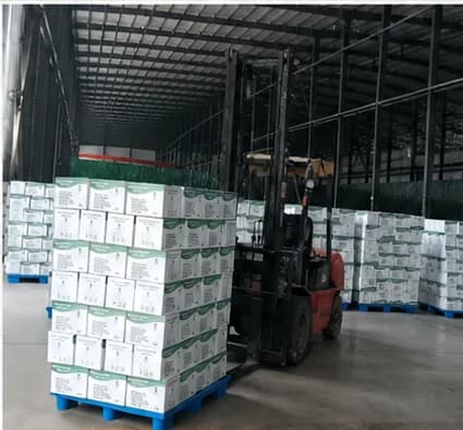 Distributor shelf stocked with MXGUARD glove boxes and Comfortia incontinence products